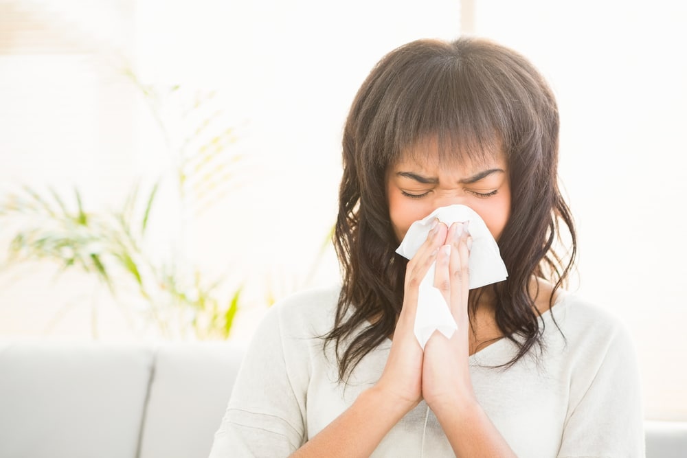 Person blowing nose