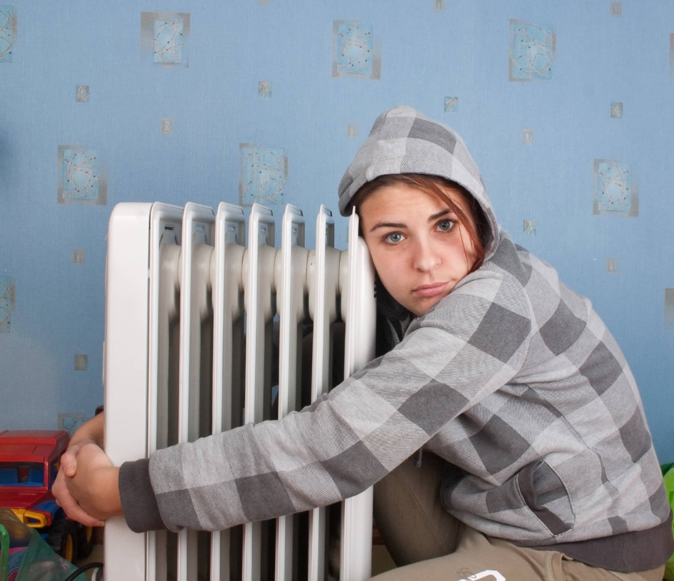 Person hugging furnace